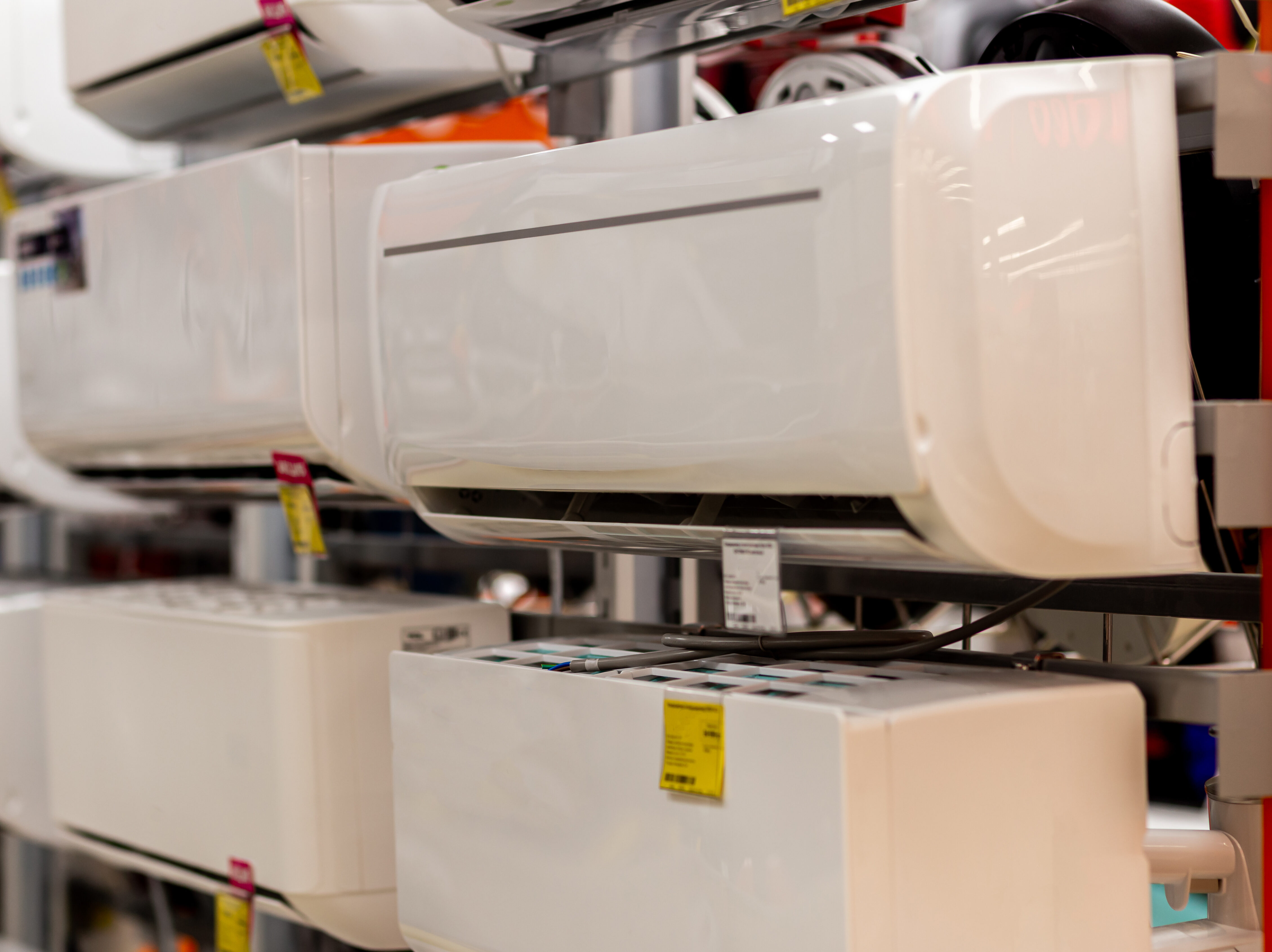 Assortment of air conditioners on the showcase of the electronic store
